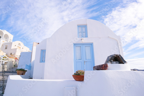 A small white house in the village Oia on the island of Santorini, Greece.