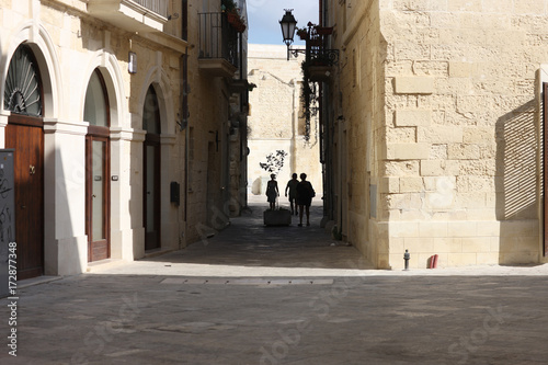 Tourists on a narrow street of an ancient city. Lecce  Apulia  Italy