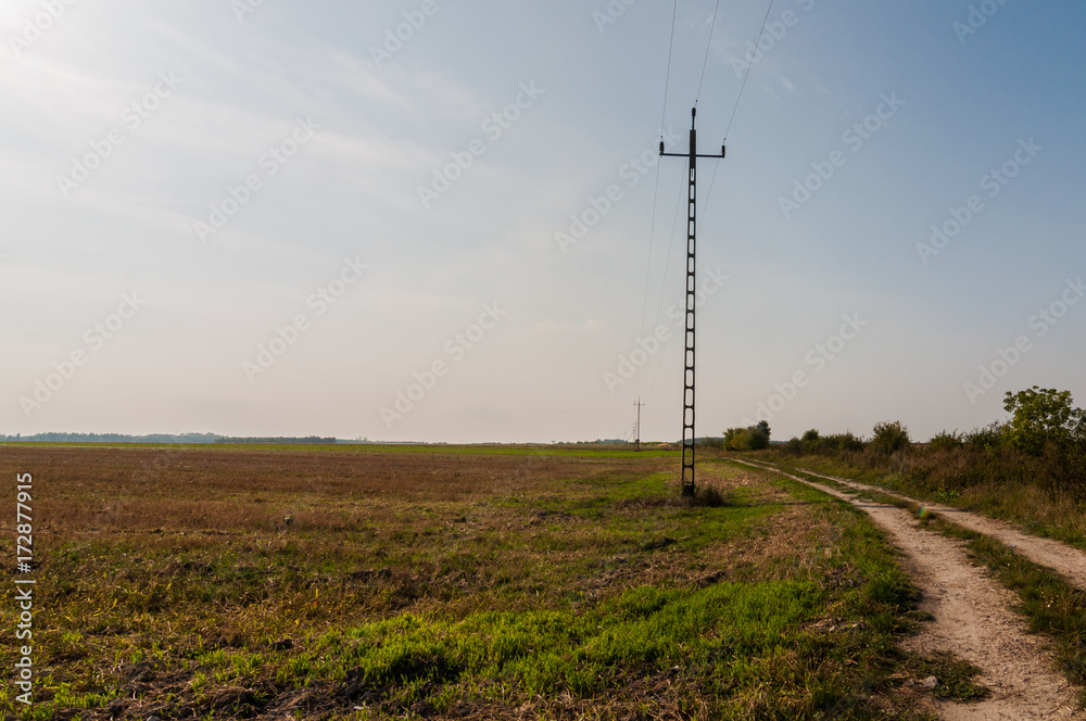 Power pole in the arable field