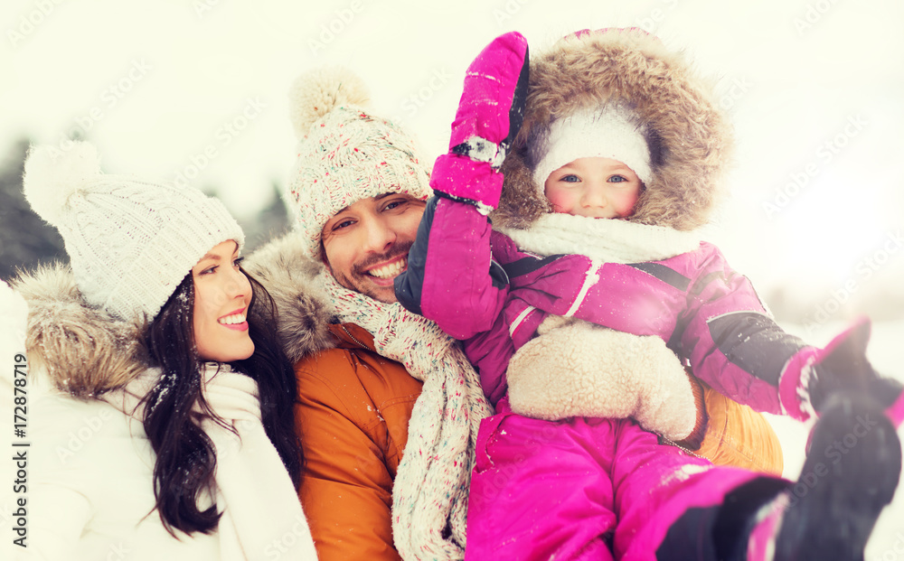 happy family with child in winter clothes outdoors happy family with child in winter clothes outdoors