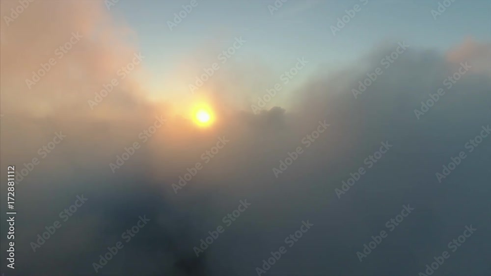 aerial view, flying through clouds at sunset aerial view, flying through clouds at sunset