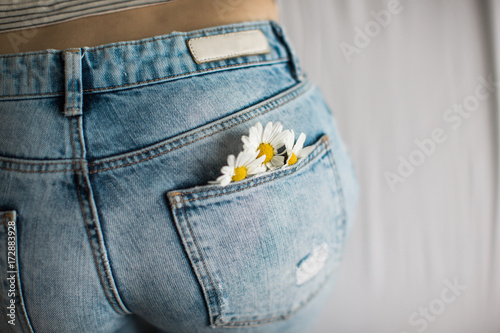 Woman with flowers in the pocket