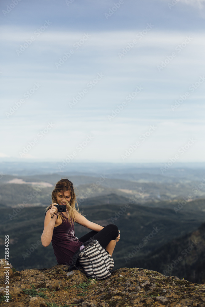 Woman Taking Photo on Mountain Woman Taking Photo on Mountain