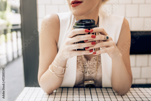 Hands of a Woman Holding a Coffee Mug photo