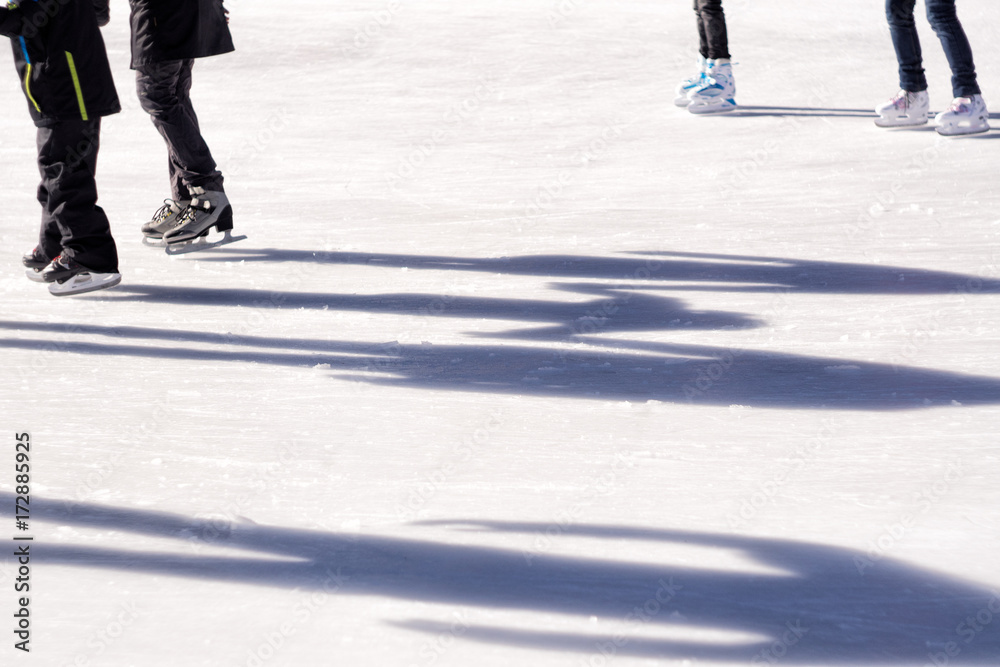 Shadows of skaters on ice rink Shadows of skaters on ice rink