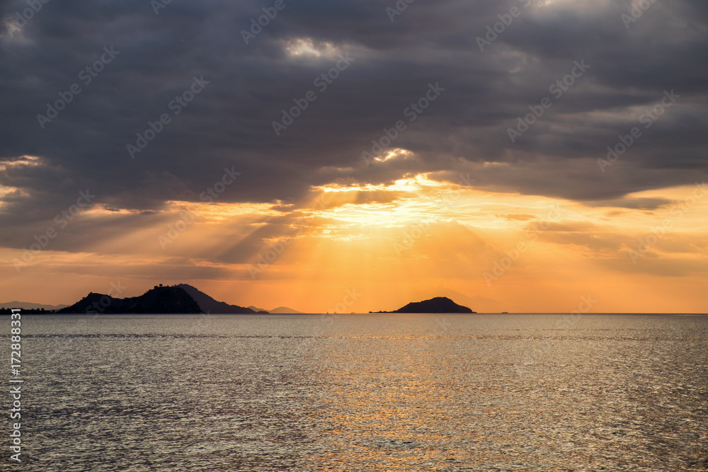 Scenic View Of Dramatic Sky During Sunset over the sea in Flores island, Labuan Bajo, Indonesia