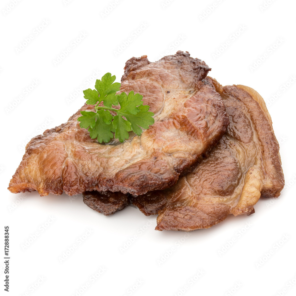 Cooked fried pork meat with parsley herb leaves garnish isolated on white background cutout Cooked fried pork meat with parsley herb leaves garnish isolated on white background cutout