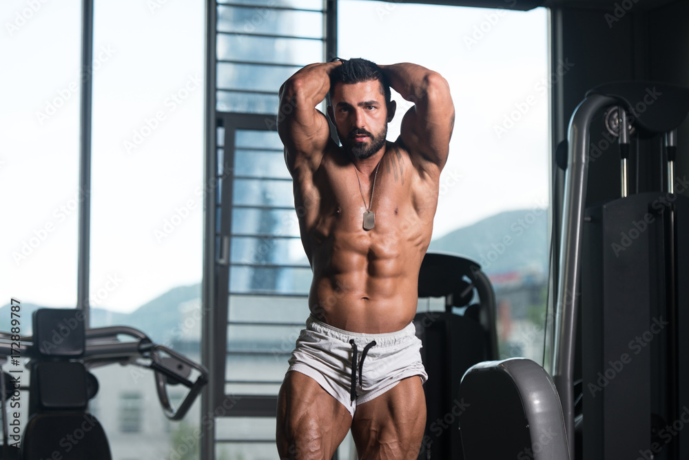 Man in Gym Showing His Well Trained Body
