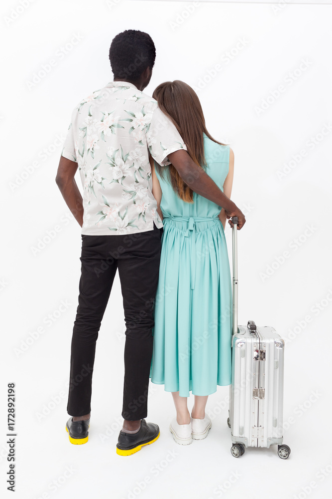 Tourist couple standing - back view