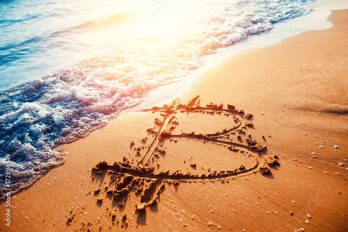 Bitcoin. Image of icon bitcoin on golden sand, in background sea sun light. Concept freelance, stock exchange photo