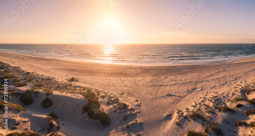 Aerial view of beach at sunset