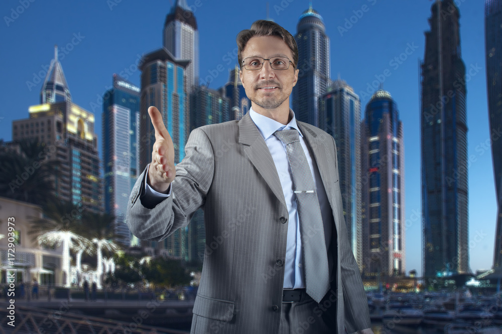 Successful businessman giving a hand for handshake Successful businessman giving a hand for handshake
