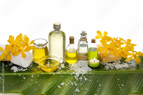 Spa setting on banana leaf with yellow orchid  candle  salt