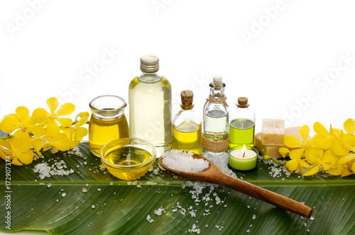 Spa setting on banana leaf with yellow orchid  candle  salt in spoon