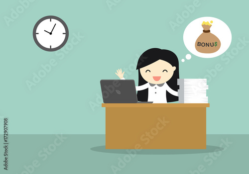Business woman working on her desk till late because she expected for bonus. 