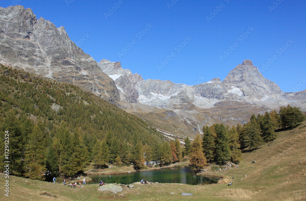 Lake Blue of Breuil-Cervinia at the foot of Matterhorn in autumn, Italy