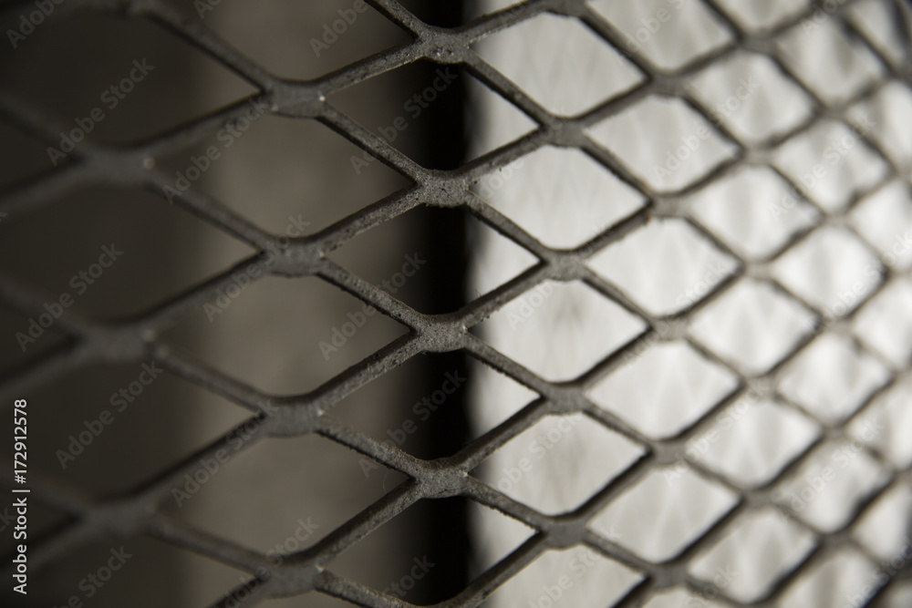 Mesh security covering in parking garage . Mesh security covering in parking garage .