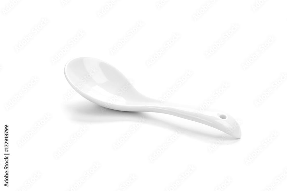 white ceramic spoon isolated on white background