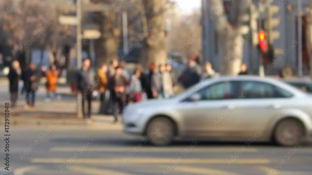 Time Lapse. A bunch of people out of focus traversed the road in front of the camera Time Lapse. A bunch of people out of focus traversed the road in front of the camera