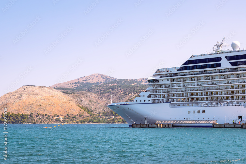 Side view of cruise ship docked in Greece, a Mediterranean port.