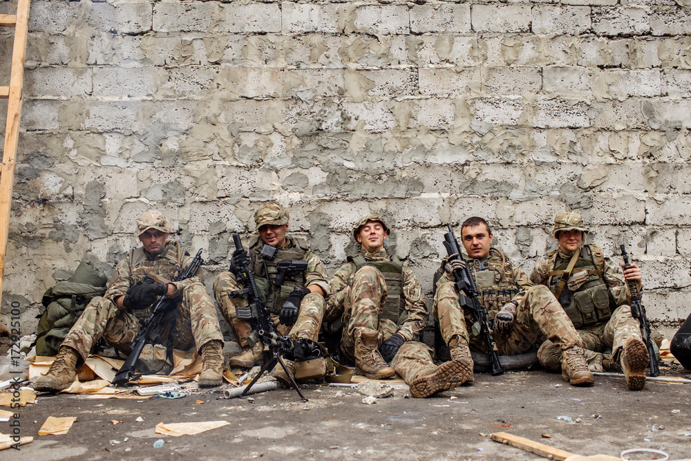 Fototapeta premium british rangers sitting and looking at the camera