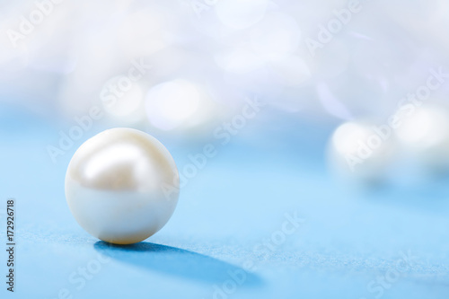 Photo pearls on the blue background