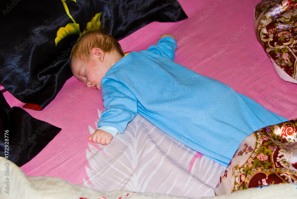 Sleeping baby boy face down at home