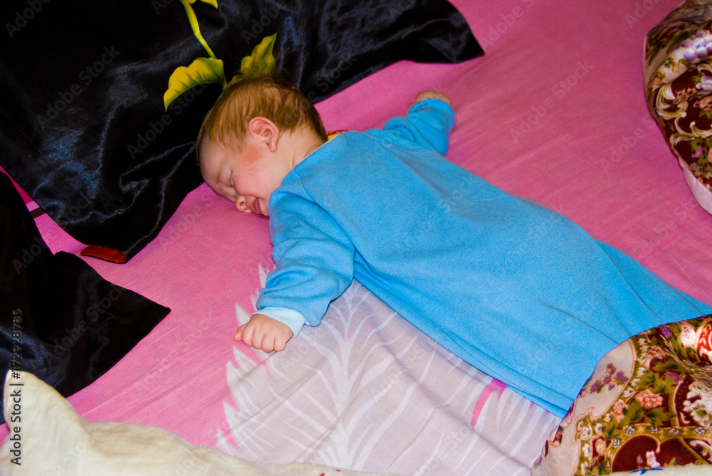 Sleeping baby boy face down at home