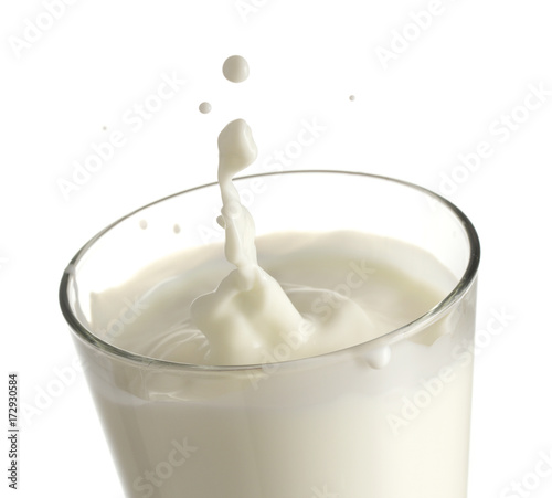 splash in the glass of milk isolated on white background