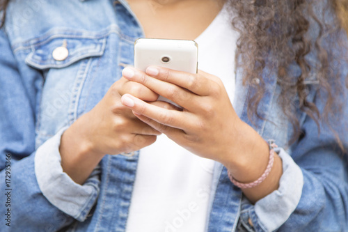 young afro woman using cellphone