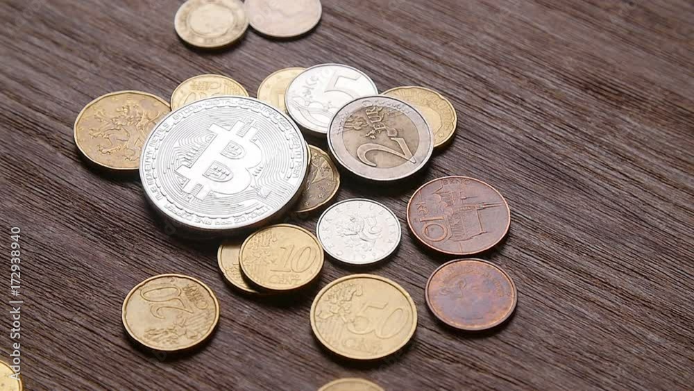 bitcoin coins and euro are falling on the table bitcoin coins and euro are falling on the table