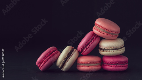 Macaroons on dark  background, colorful french cookies macaroons. Macaroons. Gift for 8 March - International Women's Day © Aliaksei