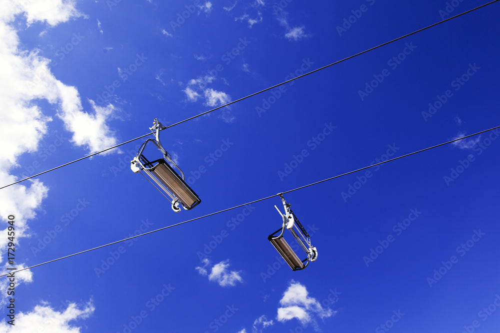 Empty Lifts in the blue sky in the alps Empty Lifts in the blue sky in the alps