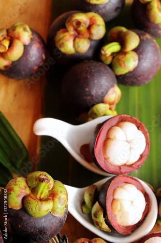 Mangosteen fruit is delicious on wood background
