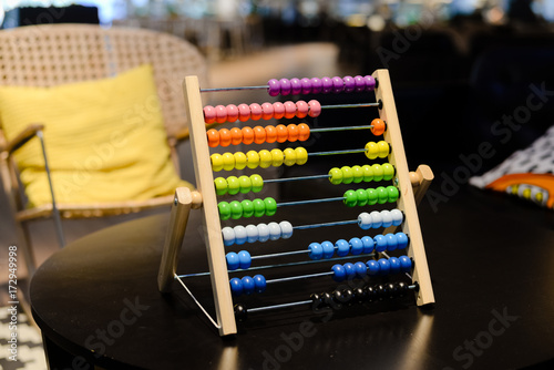 Close up on colorful abacus playful activity  educational interior background. Happy joyful developmental lifestyle