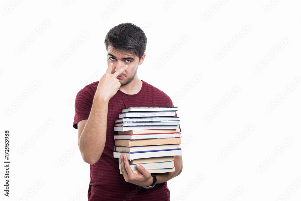 Student holding pile of books showing look into eyes Student holding pile of books showing look into eyes