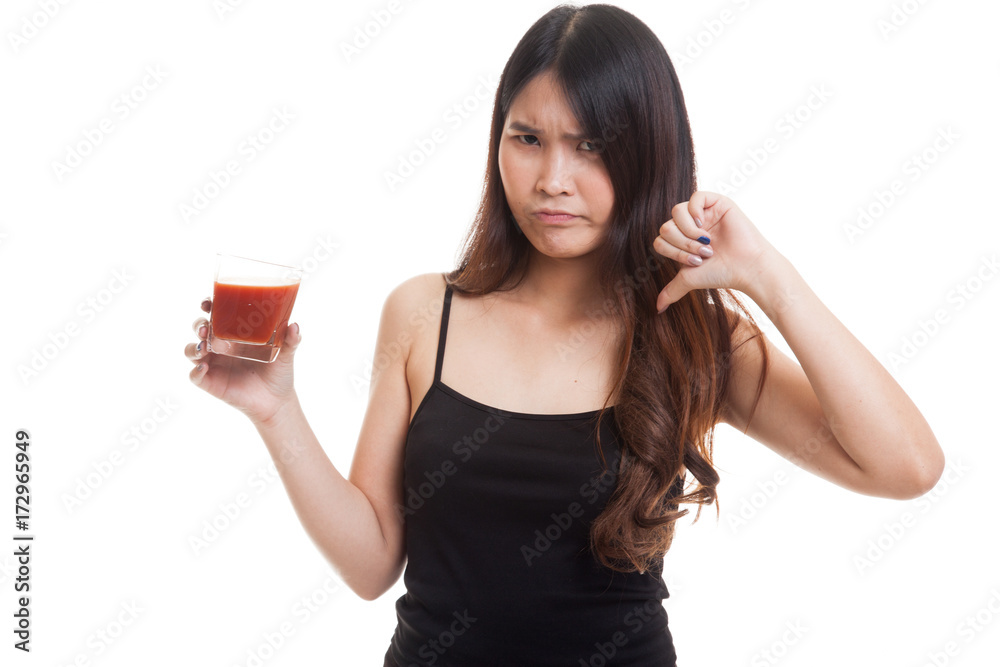 Asian woman thumbs down hate tomato juice. Asian woman thumbs down hate tomato juice.