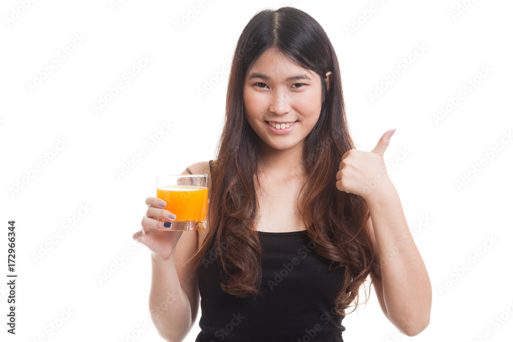 Young Asian woman thumbs up drink orange juice. Young Asian woman thumbs up drink orange juice.