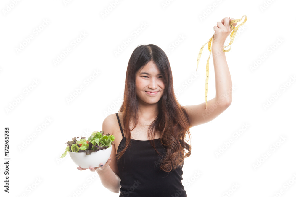 Healthy Asian woman with measuring tape and salad. Healthy Asian woman with measuring tape and salad.