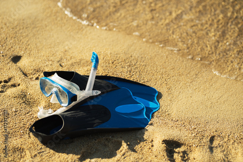 Snorkeling mask and fins on the tropical beach photo