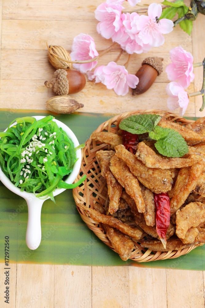 Seaweed salad with fried fish is delicious Seaweed salad with fried fish is delicious