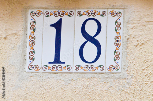 number eighteen on a beton wall