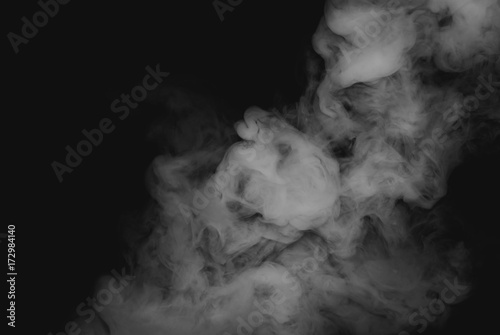 Dense white smoke isolated on black background