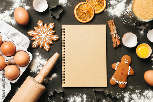 Xmas baking or cooking background. Ingredients, kitchen items for baking cookies. Kitchen utensils, flour, eggs and sugar. Text space, top view.