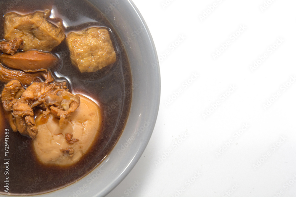 Eggs boiled stewed in the gravy on white background Eggs boiled stewed in the gravy on white background