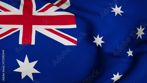 The Australian flag waving in the wind. The flag flaps in the breeze, filling the whole frame. See portfolio for similar and much more! photo