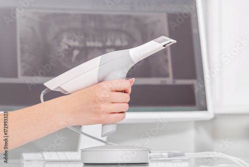 Dental 3d scanner and monitor in the dentist's office photo