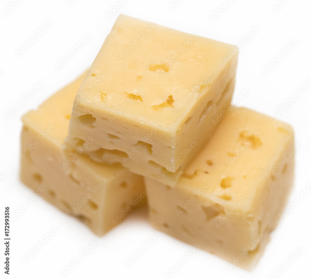Cube of cheese isolated on a white background Cube of cheese isolated on a white background