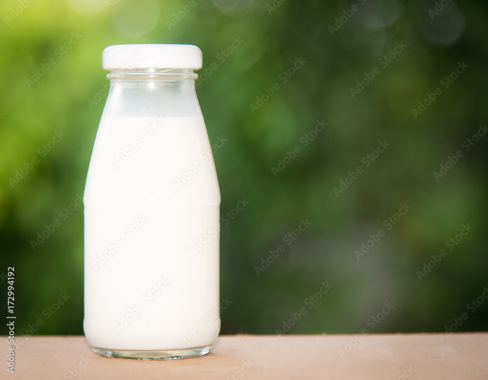 milk in glass on table. milk in glass on table.