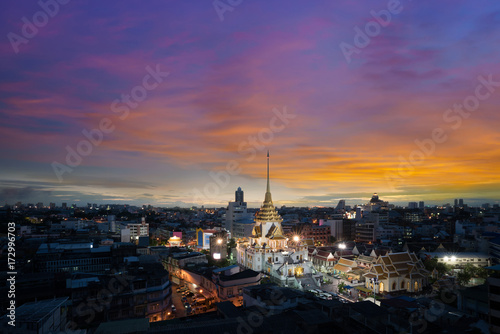 Cityscape of beautiful Wat Traimit or Temple of the Golden Buddha where the biggest solid golden Buddha statue is installed near the Chinatown , Bangkok , Thailand